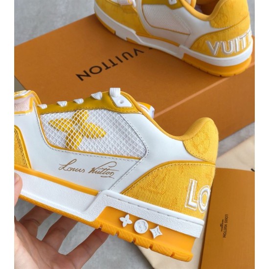 L Trainer Sneaker Yellow White Strap Low Top side detail Close up on side branding of yellow and white shoe