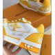 L Trainer Sneaker Yellow White Strap Low Top side detail Close up on side branding of yellow and white shoe