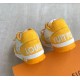 L Trainer Sneaker Yellow White Strap Low Top heel view Rear view highlighting yellow heel panels in yellow and white