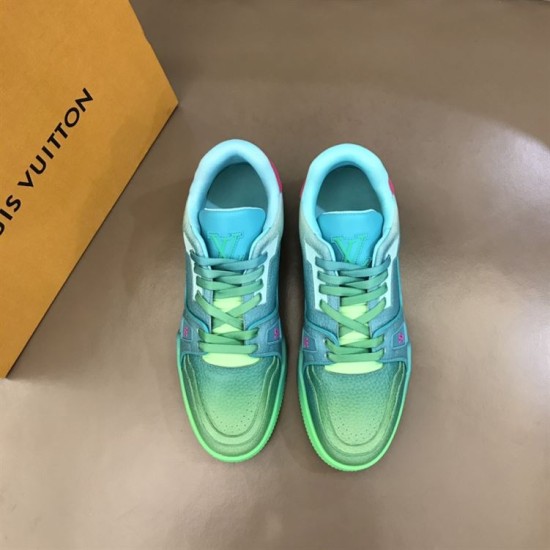 L Trainer Low Top Sneakers In Green Grained Leather - Front Laces View in green and pink Front view facing the laces and tongues of L trainer low top sneakers in green grained leather in green and pink