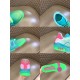 L Trainer Low Top Sneakers In Green Grained Leather - Detail Grid in green and pink Composite grid image displaying toe box, collar interior, heel, and outsole of L trainer low top sneakers in green grained leather in green and pink