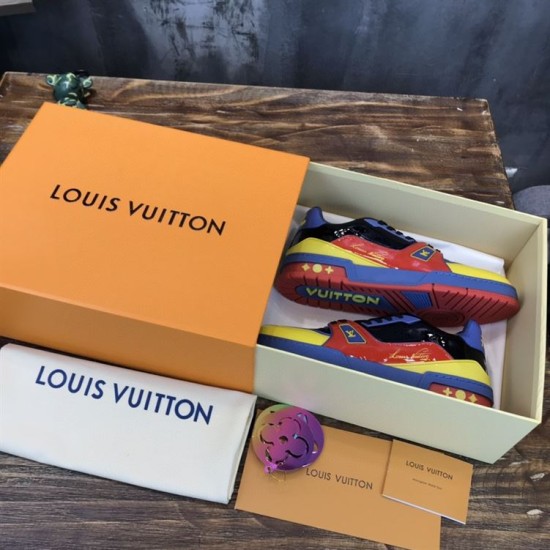Boxed Display of L Colourblock Patent Canvas Trainers in multi-colour and red The L trainers neatly arranged inside their branded orange storage box in multi-colour and red
