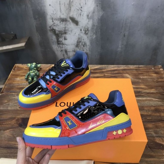 Pair Presentation of L Colourblock Patent Canvas Trainers in multi-colour and red Pair of L multi-colour trainers angled together over an orange presentation box in multi-colour and red