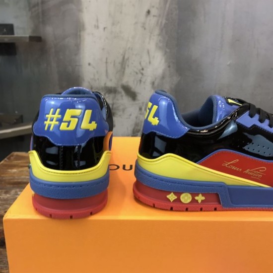 Back Heel View of L Colourblock Patent Canvas Trainers in multi-colour and red Rear heel view displaying the contrasting blue collar and yellow numbering on the L trainers in multi-colour and red