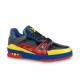 Studio Lateral View of L Colourblock Patent Canvas Trainer in multi-colour and red Studio side profile of the L multi-colour patent canvas trainer against a plain backdrop in multi-colour and red