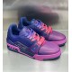 Front three quarter angle of L low top trainer leather sneakers in pink and blue gradient