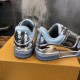 Rear Heel View of L Trainer Metallic Silver Low Top Sneakers Rear heel view displaying embossed branding on L Trainer Metallic Silver Low Top Sneakers