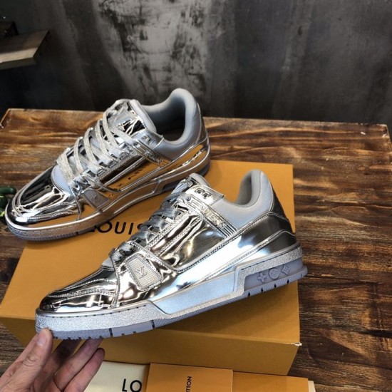 Angled Side View of L Trainer Metallic Silver Low Top Sneakers Angled perspective showing side and midsole of L Trainer Metallic Silver Low Top Sneakers