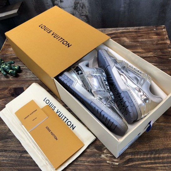 Unboxing View of L Trainer Metallic Silver Low Top Sneakers Pair of L Trainer Metallic Silver Low Top Sneakers inside branded presentation box