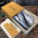 Unboxing View of L Trainer Metallic Silver Low Top Sneakers Pair of L Trainer Metallic Silver Low Top Sneakers inside branded presentation box