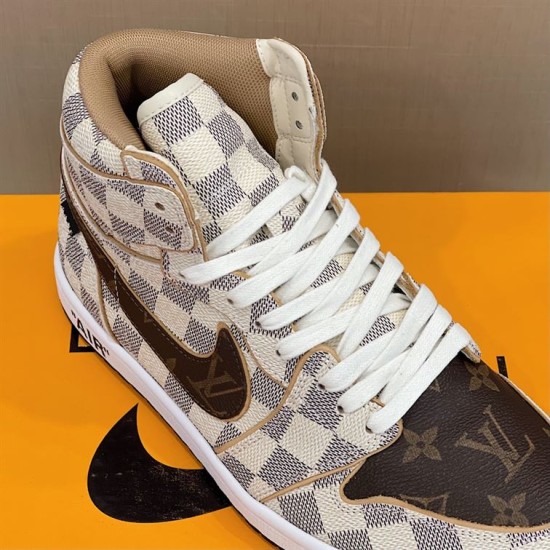 Close-up of L high top trainer showing white laces and brown patterned toe box