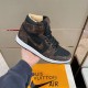Handheld outer lateral view of the brown and black L high top trainers Handheld outer side view of the brown and black L high top trainers