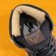 Interior collar and insole detail of the brown and black L trainers Interior collar and insole view of the brown and black L trainers