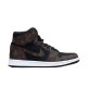 Studio side profile of the brown and black L high top trainers Studio lateral view of the brown and black L high top trainers against a plain background