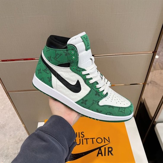 L Green White and Black High-Top Trainer Held in Hand L green white and black high-top trainer held in hand