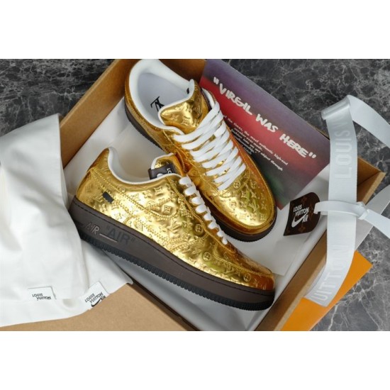 Pair of metallic gold Nike Air Force 1 Low trainers inside product box
