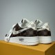 Rear three-quarter view of Nike Air Force 1 Low Patterned Brown Trainers heels