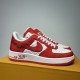Nike Air Force 1 Low-Top Red White Trainers Front Perspective Three-quarter front view of Nike Air Force 1 Low-Top Red White Trainers resting on a display box