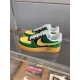 Nike Air Force 1 Low-Top Yellow And Green Trainers Pair Profile Pair of Nike Air Force 1 Low-Top Yellow And Green Trainers sitting on a glass shelf