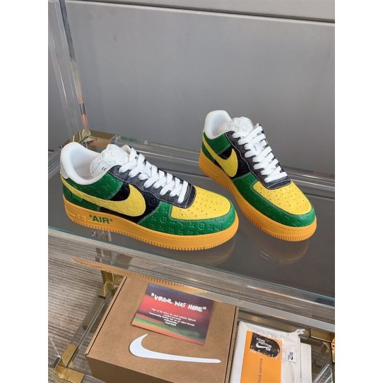 Nike Air Force 1 Low-Top Yellow And Green Trainers Angled View Top-angled view of yellow and green Nike Air Force 1 trainers displayed on glass