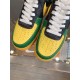 Nike Air Force 1 Low-Top Yellow Toe Cap Detail in yellow and green Close-up of the perforated yellow toe caps on Nike Air Force 1 trainers in yellow and green
