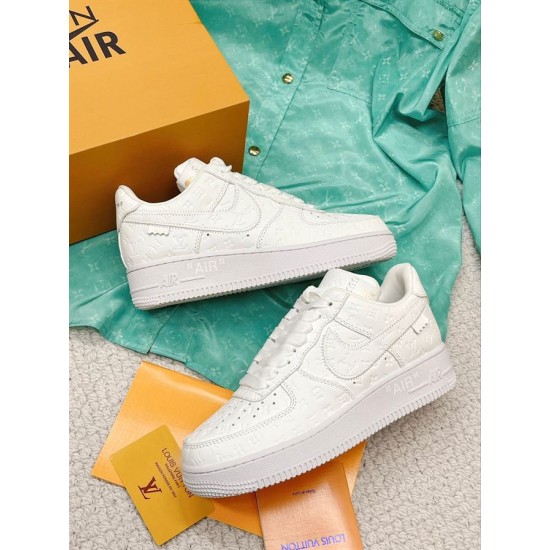 Nike Air Force 1 Low Embossed White Trainers pair top angle view