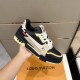 Nike Black And Cream Panel Low Top Trainer Handheld View Hand holding single Nike Black And Cream Panel Low Top Trainer laterally