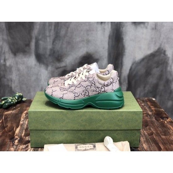 Monogram Canvas Chunky Trainers Pair on Box in beige and green Pair of beige monogram chunky trainers with green soles on a green box