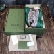 Monogram Canvas Chunky Trainers Packaging in beige and green Beige monogram trainers presented inside a green branded shoebox