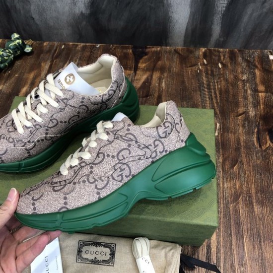 Monogram Canvas Chunky Trainers Angled View in beige and green Angled view of beige monogram trainers showing thick green midsoles