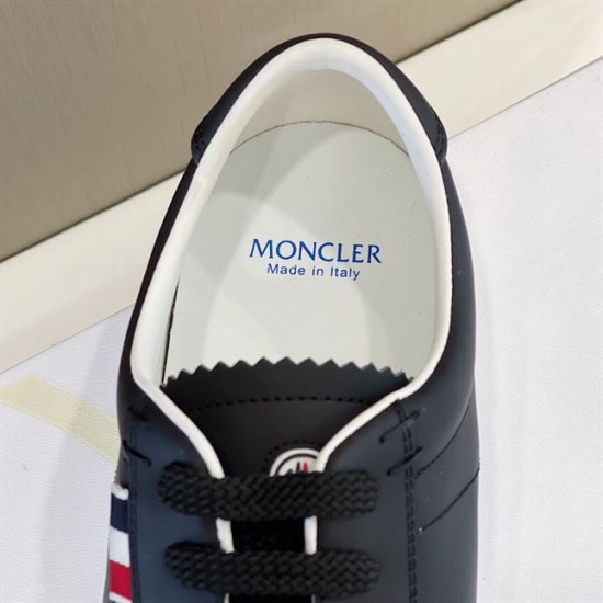 Moncler Dark Blue Trainer Insole Detail in dark blue and white Close-up view of Moncler dark blue trainer inner sole lining with blue logo branding in dark blue and white
