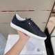 Moncler Dark Blue Trainer Side View In Hand in dark blue and white Side profile view of single Moncler dark blue trainer held in hand showing tricolour tab in dark blue and white