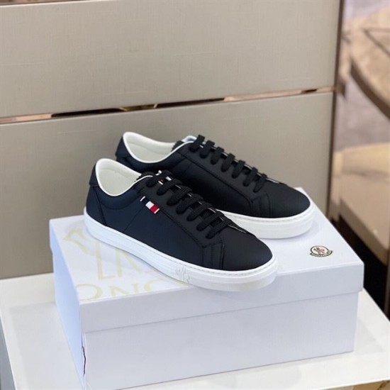 Moncler Dark Blue Trainers Pair Display in dark blue and white Pair of Moncler dark blue leather trainers resting on white shoe box