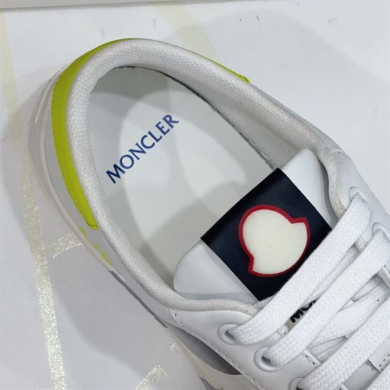 Moncler Montpellier Trainer Tongue and Collar Detail in white and grey Close-up of the inner collar and padded tongue with brand emblem on Moncler Montpellier trainer in white and grey