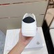 Rear view of white Moncler trainer showcasing black heel tab