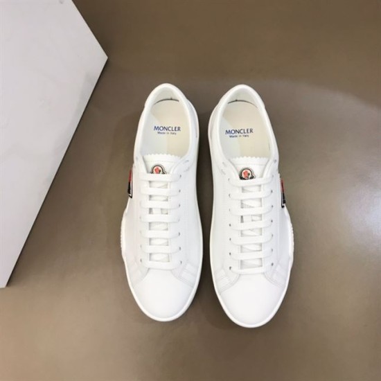 Direct top view of both Moncler Promyx white leather low-top trainers side by side