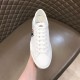 Front upper perspective of Moncler Promyx white trainer held in hand