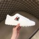 Handheld view of Moncler Promyx white leather trainer showing side logo and sole detail