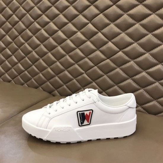 Lateral side view of Moncler Promyx white trainer resting on a surface