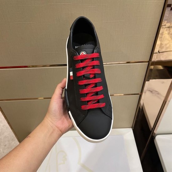 Moncler Promyx Black Trainer Front View in black and red Front view of Moncler Promyx black trainer showing red lace detail and round toe design