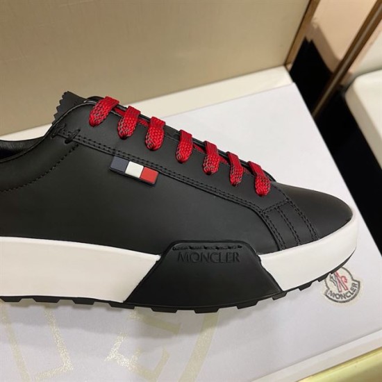 Moncler Promyx Black Trainer Detail View in black and red Close-up of Moncler Promyx trainer side panel featuring tricolour tab and embossed logo sole insert in black and red