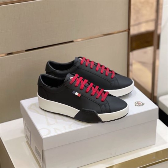 Moncler Promyx Black Low Top Trainers Pair in black and red Pair of Moncler Promyx black low top trainers with red laces displayed on a shoe box