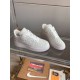 Front Three-Quarter View of L Air Force Embossed Monogram White Trainers Front three-quarter view of L Air Force Embossed Monogram White Trainers