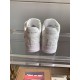 Rear Heel View of L Air Force Embossed Monogram White Trainers Rear view of white trainers showing branded heel tabs