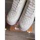 Toe Box Detail of L Air Force Embossed Monogram White Trainers Close-up of perforated toe box and laces on white trainers