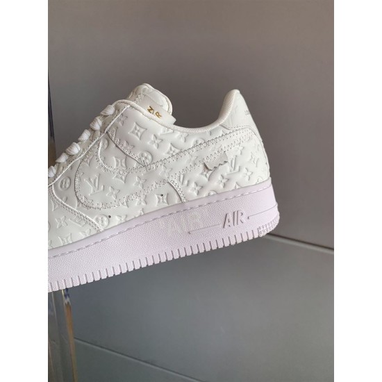 Side Panel Stitching View of L Air Force Embossed Monogram White Trainers Heel side panel and stitching detail of white trainers