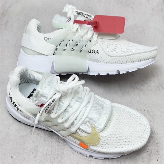 Nike Air Presto Mesh Low Top White Trainers Three-Quarter View Three-quarter view of Nike Air Presto Mesh Low Top White Trainers showing tongue and printed laces