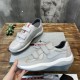 Prada Americas Cup Grey Strap Trainers Pair View in grey and white Pair of Prada Americas Cup grey strap low top trainers resting on a box in grey and white