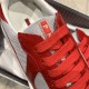 Close-up of red laces and Prada logo emblem on grey mesh tongue