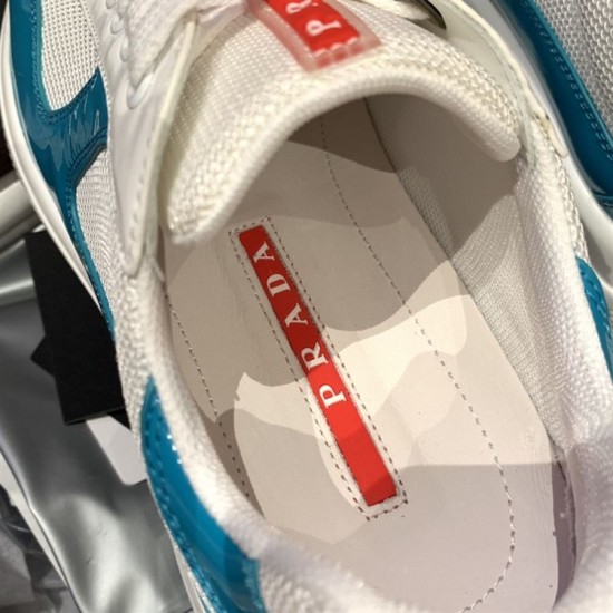 Close-up of internal footbed with red Prada logo inside blue and white trainer